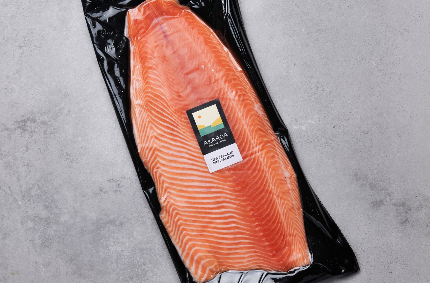 Fresh salmon fillet skin off vacuum packaged with label showing
